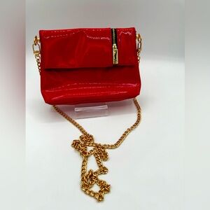 NWOT YVES SAINT LAURENT
Patent Leather Cosmetic Bag